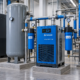 Secador de aire comprimido industrial instalado junto a compresor y tanque receptor
